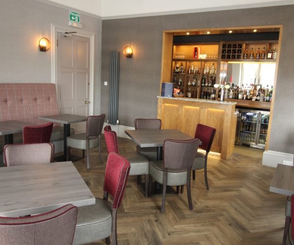 A wooden floor in a restaurant where guests can enjoy dinner.